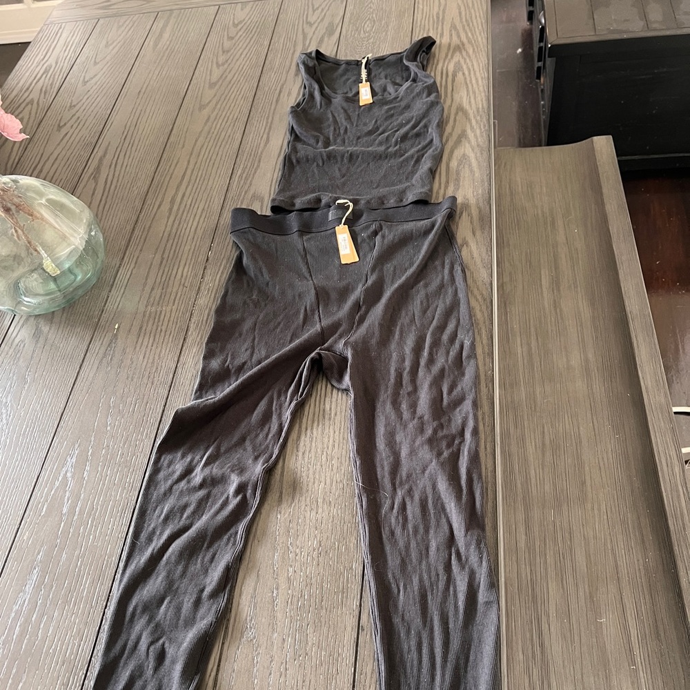 SKIMS boyfriend ribbed lounge leggings and tank.